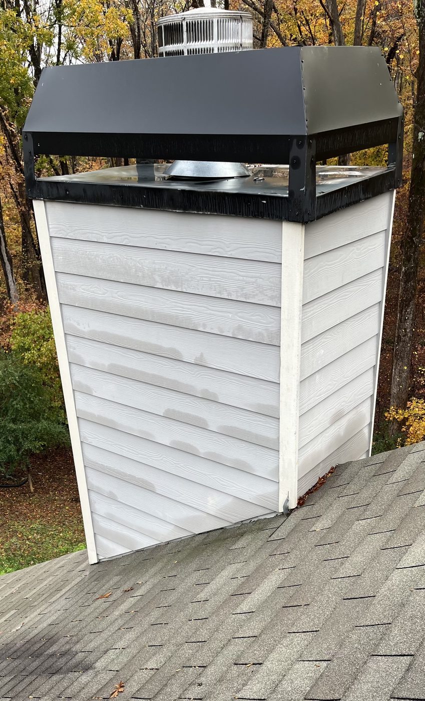 Water pooling on top of chimney cap rain pan