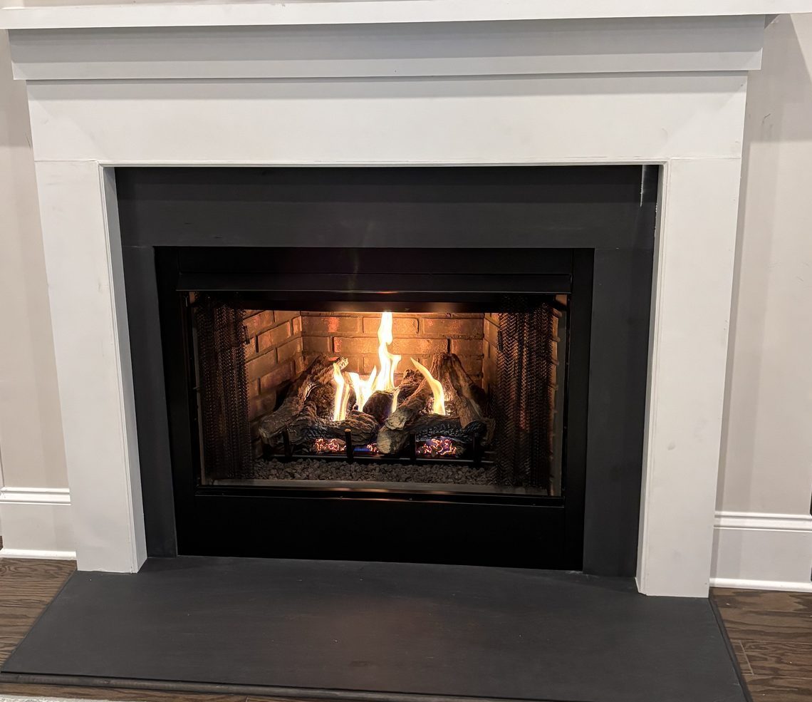 Gas log fireplace installation